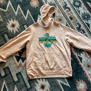 Peach colored jacket.